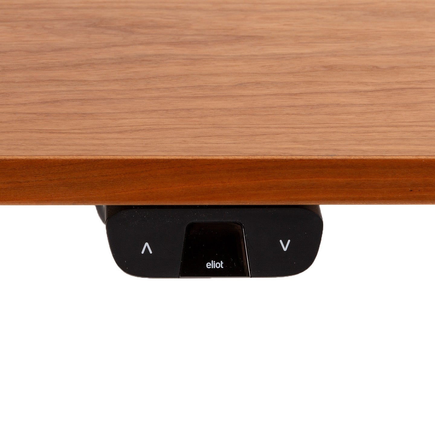 Close-up of the control panel on the TINY adjustable desk with wood finish. The panel features up/down arrow buttons and a display showing "elliot," making it a stylish Begleiter for deinen Alltag.
