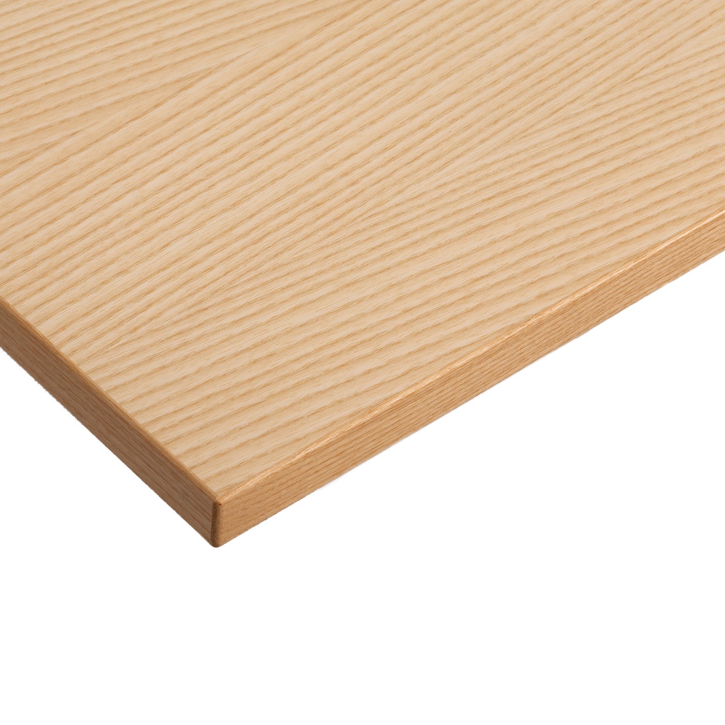 A close-up of the corner of a light-colored Tischplatte - Furnier Esche, featuring a smooth surface and visible wood grain pattern.