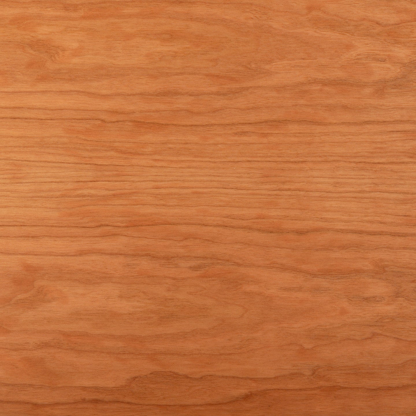 The Tischplatte - Furnier Kirsche features a light brown surface with subtle, natural grain patterns running horizontally. Its smooth texture provides a warm, uniform look—expertly crafted and made in Germany.