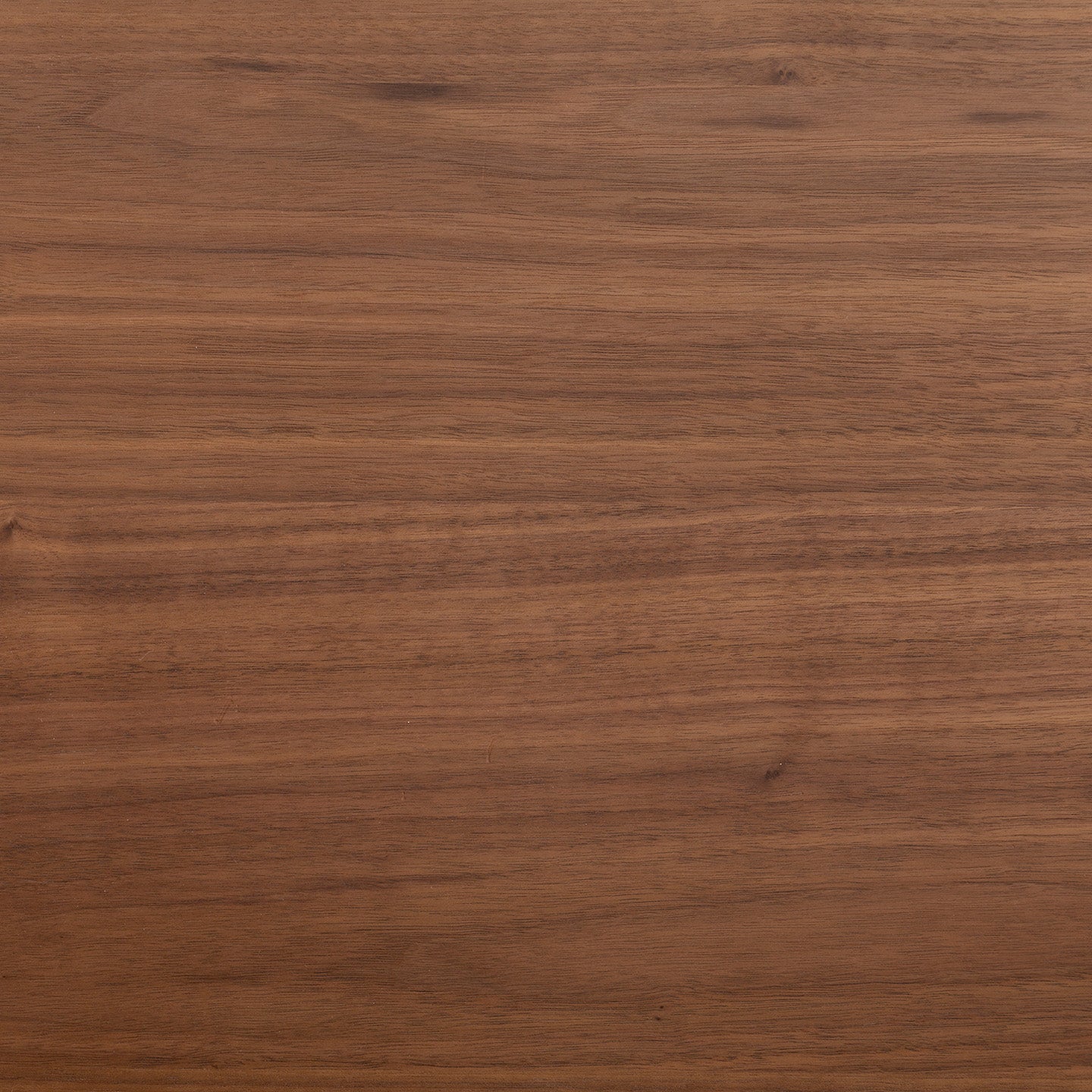 Expertly crafted in Germany, the Tischplatte - Furnier Walnuss features a smooth, medium-brown surface with subtle horizontal grain patterns and natural texture variations.