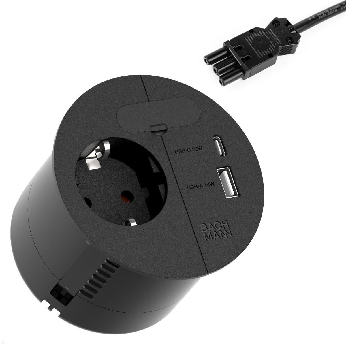 A black circular Bachmann Einbausteckdose & Kombicharger - Loop in Charge features one European socket, USB-C 22W, USB-A 18W, and a detachable cable with a nearby USA Netzstecker.