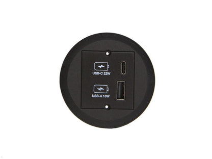 A round black Kombicharger USB A/C wall socket with integrated charging, featuring labeled USB-C 22W and USB-A 16W ports, shown against a white background.